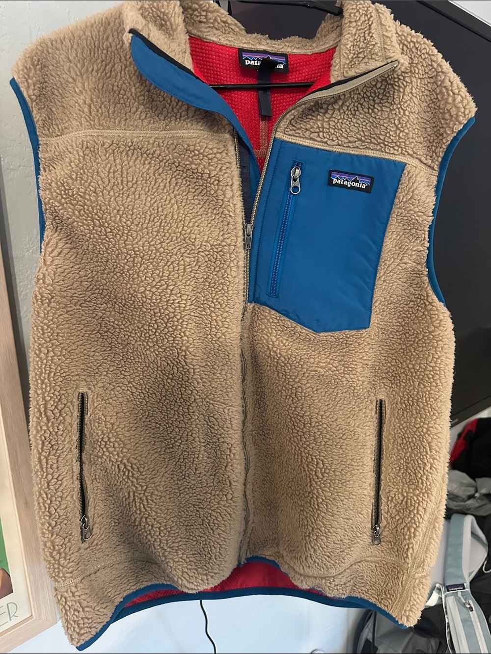 Patagonia Tan Sherpa Vest with Blue Chest Pocket and Trim